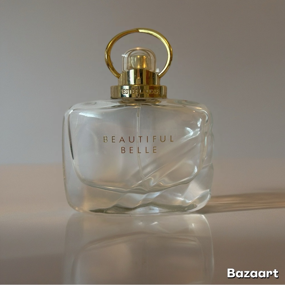 Estee Lauder Gold and White Fragrance Bottle